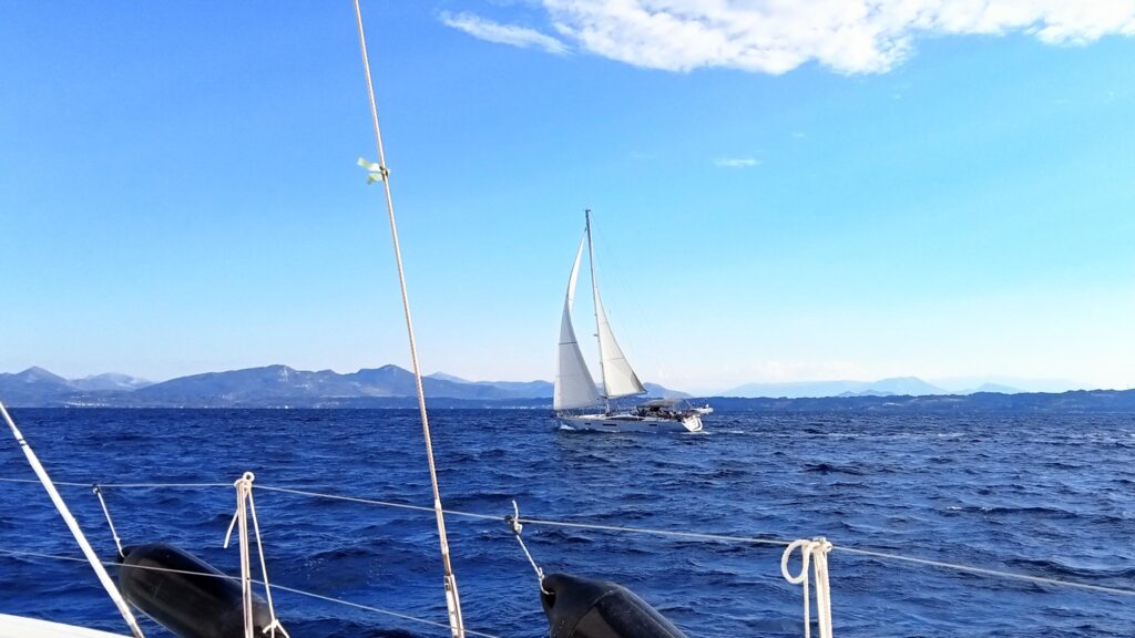 Sailing rally fleet crossing the ocean during offshore passage